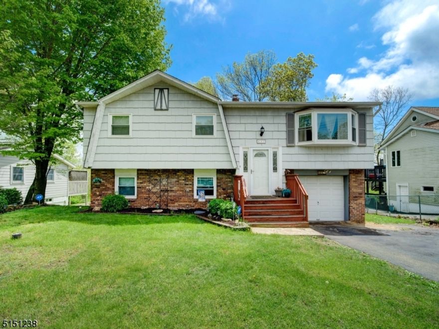 WELL MAINTAINED BILEVEL WITH LAKE VIEWS!!!!  Wood Floors throughout main level, Cathedral Ceilings, Spacious Open Floor, 3 Bedrooms, 2 Full Baths, with Pella Sliders off Dining Room to Upper Deck, Extra Large Family Room on Lower Level with new carpeting and tile floor, built in bookcase and Pella Sliders to Lower Deck and Yard. NEWER CASTLE WINDOWS 2014 & NEWER ROOF 2014.  Utility/Laundry Room on Lower Level, built in Garage with door to Deck and Yard.  Plenty of Closet Space.  Central Air.  Conveniently located Near Shopping and Major Highways (Rt. 80/46/10).  MEMBERSHIP AVAILABLE to join CRESCENT COVE BEACH COMMUNITY **** Seller in process of removing underground oil tank to above ground**** new tank to be installed in garage. Hurry, this one won't last. LAKE MEMBERSHIP UNDER NEW MANAGEMENT; 1 Year Home Warranty Included; All Water Conditioning Equipment - RENTAL