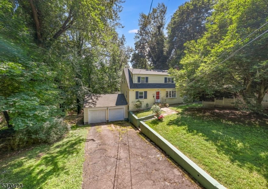 CHARMING 4 BEDROOM COLONIAL IN SOUGHT-AFTER LINCOLN-HUBBARD SCHOOL - A PERFECT CANVAS TO MAKE YOUR OWN! Boasts original hardwood flooring, plentiful storage, & flexible floorplan. Living Room provides a cheery welcome w/ a bow window overlooking the Frontyard w/ a wood-burning fireplace w/ brick surround. Bright, large Dining Room w/ crystal chandelier. Eat-in Kitchen w/ wood cabinetry. Adjacent Sunroom stretches from front-to-back of home, boasts windows on 3 exposures, outdoor access, & opportunity to use as Home Office, Playroom, Bonus Room, etc. Convenient 1st floor Bedroom w/ 2 Closets, Full Bath w/ tub/shower, 3 Hallway Closets w/ tons of storage complete the First Level. Upstairs, a cozy sitting area perched beneath sun-filled skylights leads to 3 Bedrooms & a Full Bath w/ generous closets & windows on multiple exposures. Expansive Lower Level offers the possibility to be finished for even more livable space. Wall studs & drop-ceiling framing already in place! Laundry Area w/ utility sink, large Storage Area, access to 2-Car Garage. Outside, large Front Patio w/ fencing offers a shady & private seating area featuring flowering trees. Newer roof (2015), hot water heater (2020), retaining walls (2022) and new bathroom doors, toilets & carpets. Close to restaurants, top-ranked Lincoln-Hubbard Elementary, Overlook Hospital, major highways, & NYC direct train. Home to be sold in AS-IS condition.