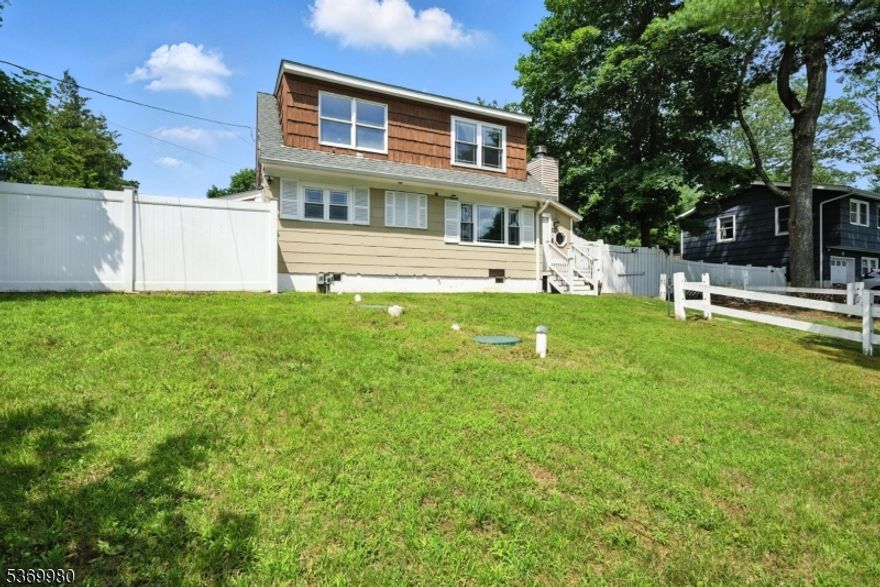 Charming, renovated Cape on quiet street in lovely Morris County neighborhood! This cosy home features many top quality upgrades! Expansive, yet cozy living room with wood burning fireplace. Formal dining room with wainscoting and renovated kitchen with stainless steel appliances. Updated full bath with stall shower. Upstairs, two generous sized bedrooms. The primary suite boasts a walk in closet with barn doors. Walk out to deck and fenced in backyard. Newer vinyl privacy fence. Full basement with laundry. Tons of potential and storage. Newer mechanicals, roof & septic. Public water, central air & propane gas. Make this charming cape your home. Desirable Chester Twp. with Randolph zip code ?  low taxes, and highly recognized and top rated school system.