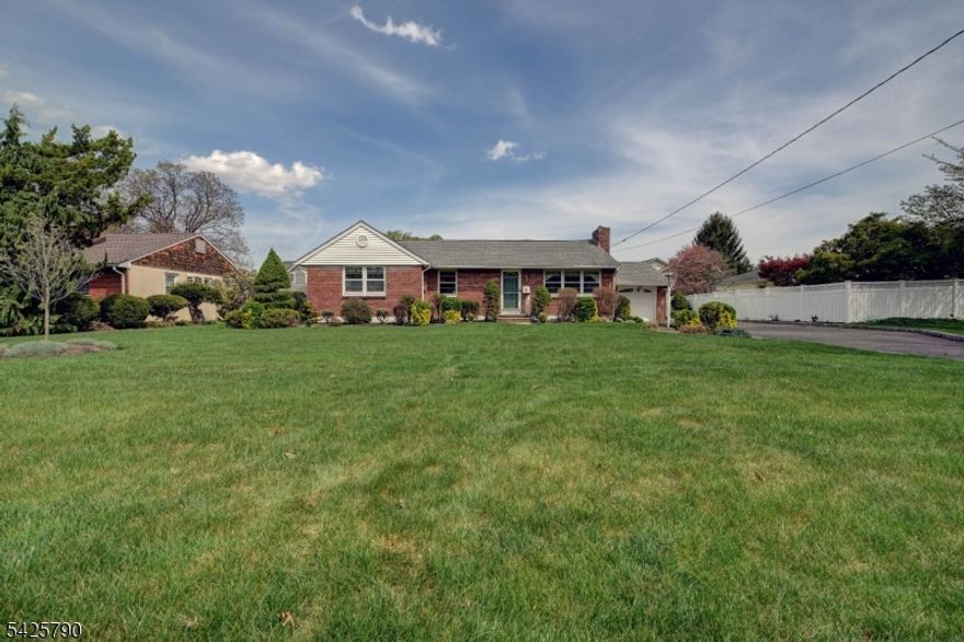 Pride of ownership throughout. This meticulous 3 bedroom, 2 1/2  bath ranch features a beautiful family room addition with 2 skylights, a window bench seat and Anderson windows overlooking the backyard. Updated kitchen with plenty of cabinets and Corian countertops. Kitchen features stainless steel appliances, including a GE Profile Convection oven with 5 burners and griddle. Separate island includes seating and a separate dining area, as well. Other features include formal living room with fireplace, dining room, updated baths, full finished basement with family room and entrance into the garage. Basement also has a cedar closet and tool room with workbench. Hardwood floors throughout, updated electric and central air, gas heat. Family room has hot water baseboard heat and the rest of the house is radiators. 2 zones. The basement has a cedar closet, LED lights, a work bench area, sink and crawl space. Laundry area was moved up to the main floor. The backyard is fenced in and includes a storage shed. Plenty of space. The back door leads to a patio and there is a second storage shed. In-ground sprinklers. Attic and attic fan. Ring cameras & 2 doorbells included. Refrigerator in basement is included in sale. Prime location. Close to parks, schools, restaurants, shopping, highways, and transportation. There is a town lake for swimming and fishing, a golf course, and a bike/pedestrian walking path. Easy commute to NYC. Don't miss this wonderful home!