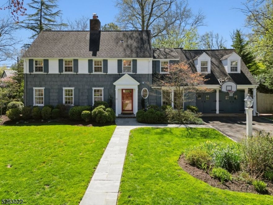 FABULOUS SHORT HILLS COLONIAL * IDEAL NEIGHBORHOOD * A wonderful opportunity to own a completely renovated Colonial with beautiful architectural details located in a fab "block party" neighborhood. The easy-flowing floor plan boasts an inviting entrance foyer, elegant living room with wood-burning fireplace, powder room, family room/1st floor office, dining room with bay window and completely renovated, gourmet eat-in kitchen. Kitchen has wood cabinets, marble counters, Wolf 5-burner cooktop & double wall oven, Bosch dishwasher, center island w/ bar seating, gorgeous skylight, sep breakfast area, back staircase, adj family rm & mudroom w/ garage access. Upstairs: 4 generous bedrooms, 3 sparkling bths & laundry. The luxurious primary suite is a welcome retreat w/ two closets & contemporary marble bathroom w/ a double vanity, custom sconces & glass shower. LL: rec room, half bath, storage. Outside, relax on the private patio for easy indoor-outdoor entertaining or play in the level side yard. MORE: CAC, wood flrs, recessed lighting, security system, 8-zone lawn sprinklers, dog fence & 2-car garage. WALK TO EVERYTHING: both the Millburn & Short Hills stations (0.8 miles) for a quick trip to NYC, Millburn MS & Millburn High School, downtown shops, delicious restaurants, Starbucks & the famous Millburn Deli. This is a rare opportunity to own a beautifully renovated home on expansive property, with every modern amenity, in a warm & welcoming neighborhood.