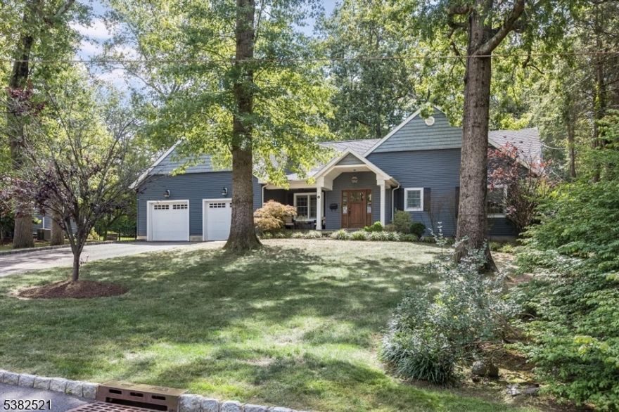 This exceptional 4-bedroom, 4.1-bath ranch was masterfully gut-renovated and thoughtfully expanded in 2012. Designed with a courtyard concept, the home creates a seamless connection between indoor and outdoor living. Set on over .5 acres of flat property, it sits on a picturesque circle in one of Livingston's most coveted neighborhoods.  The heart of the home is a chef's kitchen with tray ceiling, custom white cabinetry, quartzite countertops, and an oversized island. Wolf and Sub Zero appliances, a farmhouse sink, built-in wine refrigerator, and designer lighting combine timeless style with modern function. The open-concept layout flows into the sun-filled breakfast area and airy family room with soaring ceilings, wood-burning fireplace, and direct patio access.  The versatile floor plan includes four bedrooms, two with en-suite baths. The primary suite offers dual custom walk-in closets, a spa-like bath, and private patio walk-out. A hall bath with tub-shower combo, separate toilet, and linen closet serves the additional bedrooms, while a stylish powder room and mudroom off the oversized 2-car garage complete the level.  The finished basement spans the home's footprint with a built-in bar, recreation and media areas, high-end flooring, and a full bath. Outdoors, a covered dining patio overlooks a wide, level backyard. A rare blend of thoughtful design, timeless finishes, and an idyllic, park-like setting, this move-in-ready home checks every box.