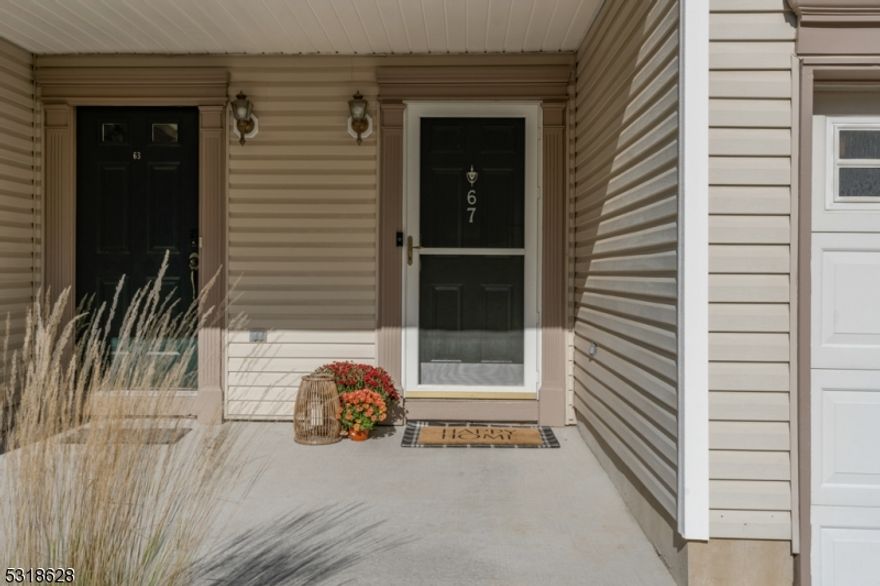 Nestled in sought-after Rose Arbor, just minutes from the vibrant heart of Morristown, this stunning 2-bedroom, 2 1/2 bath turnkey townhome blends modern living with suburban charm. As you step inside, you're greeted by gleaming hardwood floors and an open floor plan, perfect for entertaining. The gourmet kitchen, a chef's dream, showcases quartz countertops, stainless steel appliances, a chic subway tile backsplash, and a custom pantry with automatic lighting. As you prepare meals, the dining area and living room flow seamlessly, offering 9-foot ceilings, recessed lighting, and a warm ambiance. Step through sliding glass doors to your private patio, ideal for relaxing or enjoying a glass of wine at the end of the day. Upstairs, the primary suite offers two custom walk-in closets, a spa-like ensuite with a double vanity, soaking tub and separate tile shower. Enjoy your morning coffee from the private balcony overlooking the lush landscaped grounds. The second bedroom, with its own custom walk-in closet, provides comfort and convenience, with easy access to the main bathroom. Laundry becomes a breeze with the second-floor laundry area, equipped with a new GE front-loading washer and dryer. The basement offers endless possibilities to expand your living space, while the one-car garage, outfitted with built-in storage and an electric car charger hookup, ensures modern convenience. With its prime location, modern upgrades, and thoughtful design, this townhome has it all!