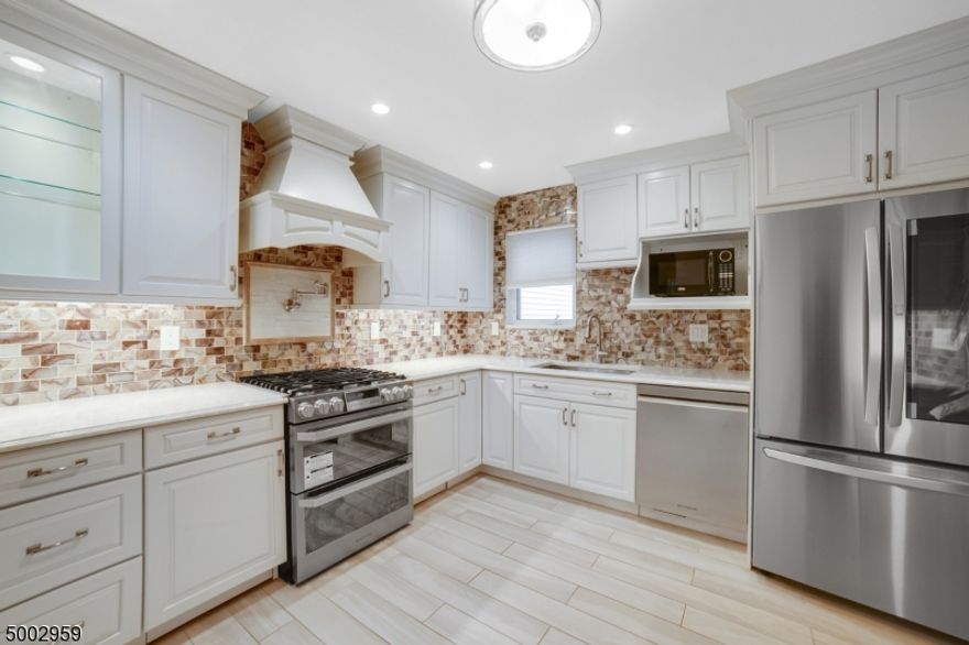 Excellent location & amenities. Chefs dream kitchen with custom cabinets, pantry, SS smart appliances, vented hood, pot filler & granite counters. Open floor plan - all bedrooms have en suite baths. Wood floors, newer carpet on 2nd level & recessed lights - 1st floor master suite has walk in closet, luxury bath with tub, shower & double sink vanity - Spacious living room has vaulted ceiling open to dining room with sliding door access to large deck with gas BBQ & yard - 2nd level bedrooms have fans, attached baths - gas fireplace & skylights in loft area. Powder room, 2 car garages - Laundry with washer & dryer - storage in basement. complex offers abundant visitor parking, pool, club house, playground & tennis. Easy access to shops, schools & highways. tenan  pays first $150 for repairs per occurrence. Prior pictures when vacant