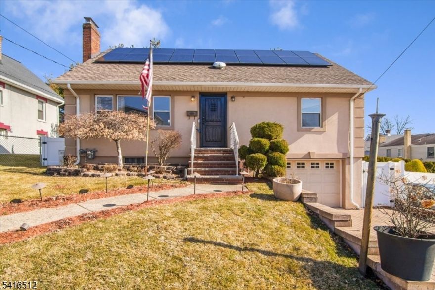 Welcome to 565 Center Street in the heart of Wood-Ridge NJ. A spacious and well-maintained home offering comfort, flexibility, and a very rare oversized property! This expanded Cape-style residence features four generously sized bedrooms and two full bathrooms, providing plenty of space for living, working, and entertaining. Tons of natural light flowing throughout the entire home. The main level offers a living room, an inviting eat-in kitchen, & well-proportioned bedrooms, while the upper level provides additional private living space ideal for bedrooms, a home office, or guest accommodations. Brand new hardwood floors installed in the entry foyer & bedrooms. The home also includes a partially finished basement offering extra recreational space, storage, or future potential. Set on a unique double lot, the property features a large backyard perfect for pets, outdoor gatherings, gardening, or expansion possibilities. Additional highlights include solar panels for energy efficiency and ample off-street parking. Conveniently located near schools, parks, shopping, and NJ Transit with easy access to major highways and a short commute to NYC. A rare opportunity to own a versatile home with exceptional outdoor space in one of Wood-Ridge's most desirable residential neighborhoods. FYI sale comes with 2 lots! Buyer would be responsible for both annual tax amount for Lot 12.01 & 12.02 (565 Center st & 56 Columbia st.)