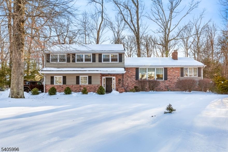 Set on nearly an acre in one of Scotch Plains' premier neighborhoods, this spacious custom split-level offers a flexible layout ideal for both entertaining and everyday living. Tucked on a quiet, tree-lined lane, the home blends space, functionality, and comfort. The ground level features a welcoming foyer, cozy family room with wood-burning fireplace and bay window, powder room, large closets, and access to the two-car garage. Just a few steps up, the main level includes a sunlit living room with picture window and fireplace, a banquet-sized dining room, and a bright den perfect as a playroom, office, or reading room. The large, open kitchen overlooks the backyard and offers ample cabinetry, a breakfast bar, and eat-in area. French doors lead to a covered mahogany deck with beadboard ceiling, skylight, and ceiling fan perfect for indoor-outdoor living.Upstairs are four spacious bedrooms, including a primary with private bath. A full hall bath with double vanity serves the other bedrooms. The finished basement adds a rec room, office, laundry, utility space, and storage.The peaceful, nature-filled backyard features a patio, covered porch, and three sheds your own private oasis. Bonus: Furnace and CAC new in 2025 and HWH new in 2024!