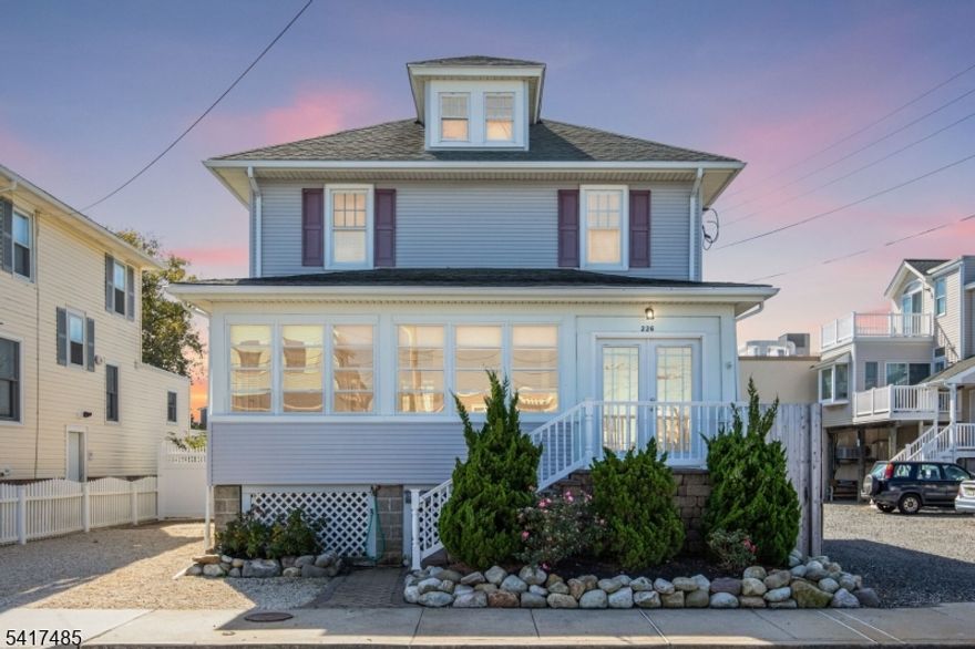 Welcome to this beautifully renovated classic oceanside retreat, just 2  blocks from the beach and steps away from everything Beach Haven has to offer. Thoughtfully upgraded in 2022, this home strikes the perfect balance between timeless charm and modern luxury.The sun-drenched first floor features a delightful sunporch and an open, airy floor plan, while original French pocket doors add character and a natural sound barrier between spaces. The open kitchen dining room create an attractive flow for family style living. A full bath and  laundry complete this level for effortless everyday living.Upstairs, the second floor offers three bedrooms and two full bathrooms, including a serene primary suite with a private ensuite. Both bathrooms are appointed with radiant heated floors for a touch of everyday indulgence. A private staircase leads to a fourth bedroom on the third floor   ideal for guests or a quiet retreat.Every room is equipped with its own independent heating and cooling system, ensuring personalized comfort year-round.Set on an oversized lot, the expansive backyard is an entertainer's dream   complete with a built-in gas grilling station, an above-ground pool with safety fencing, an outdoor shower, a half basketball court, and a fully fenced yard with room to grow. The detached garage provides generous storage, a second refrigerator/freezer, and convenient running water by the pool. Don't miss this special opportunity.