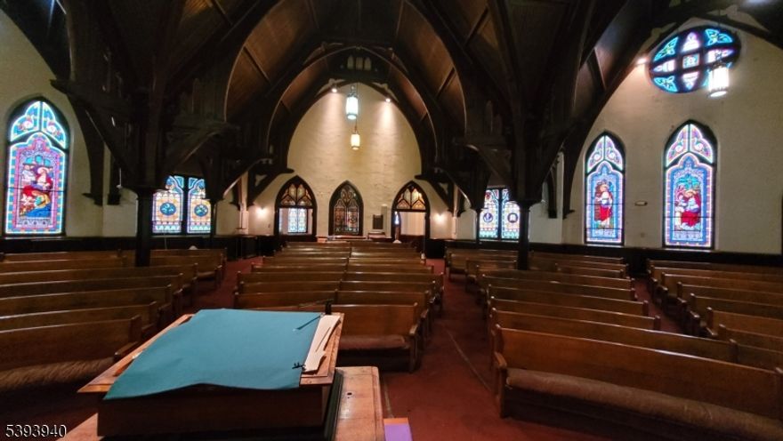 RELIGIOUS FACILITY WITH AN ADJACENT DETACHED HOUSE AND PARKING LOTS ON ONE 0.40  ACRES ACROSS FIVE PARCELS RELIGIOUS FACILITY (12,020  SF) The main level consists of a sanctuary, front lobby, a conference room, classroom with stage, small office and bathroom. The lower level is partially finishedand consists of a fellowship room, choir room, storage room, kitchen, boiler room and bathroom. HOUSE (2,965  SF) The house consists of a first floor with four rooms and two bathrooms, a second floor with two larger rooms, a smaller room, kitchen and full bath; and a third floor with two bedrooms and a bathroom. The full basement is unfinished. PARKING LOTS The offering contains 3 parking lot parcels, two contiguous and one separate on the corner of Springs Street and Weiss Street. Parcel ID's: 08 05807-0000-00018 08 05807-0000- 00017, 08 05805-0000-00001, 08 05805- 0000-00003, 08 05805-0000-00004. Religious building is 14,985 SqFt. Parking 30  Paved Spaces, Street.