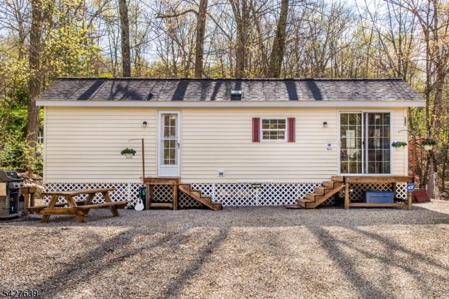 Looking for a nearby retreat? Start planning your summer getaway in the sought-after Tall Timbers community! Perfect for weekend escapes or an affordable entry into a vibrant recreational community. This clean and well-maintained 1-bedroom unit features a bright open living area with a vaulted ceiling and abundant natural light, creating an inviting and airy feel. With washer and dryer hookups and parking for multiple vehicles, it offers a simple, low-maintenance way to enjoy seasonal living. Tall Timbers is a gated community offering 3-season living with a wide range of amenities including multiple swimming pools, lake access with fishing and boating, pickleball, volleyball and basketball courts, playground, mini golf, clubhouse, billiards/game room, hiking trails and more.Conveniently located just minutes from Mountain Creek, local wineries, golf courses, the Appalachian Trail and High Point State Park. Seasonal use only, not permitted for full-time primary residence. Trailer is not permanently affixed and will transfer via bill of sale.