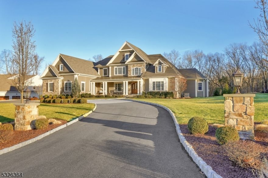 Stunning 5 years young, custom 4BR, 4.1 bath home set on a glorious 3.46 acres of peace, privacy and nature. Located on a desirable quiet cul de sac of new homes this quality construction home has over 5,000 sq ft, fine finishes & 9 ft ceilings on 1st and 2nd levels. Beautiful curb appeal w/ its charming front porch, gracious circular driveway, blue stone patios w/ hot tub & built-in gas grill, level backyard & beautiful views of nature surrounding. The open concept LR & kitchen is the heart of the home with its wall of picture windows streaming in natural light. Chef's kitchen will delight with its Jenn air appliances, large center island breakfast bar, eat in breakfast area & access to the patio. One floor living with primary BR ensuite on first level with coffered ceiling, access to patio, primary laundry room, 2 walk-in closets, HW flooring and its own private den w/ custom built-ins & tray ceiling, gas FPL. Primary BA adorns soaking tub, 2 vanities, walk-in shower w/ hydro jets & dual shower heads. 2 story foyer, powder rm, DR, office & gym & mudroom round out the 1st level. 2nd level hosts another FR overlooking the backyard & 3 add'l ensuite BRs. Features: 6 zone Sonos sound system, built-in Kohler generator, 4 zone security camera system, 3 car finished garage equipped w/ electric car charger, garage tech epoxy fl, Wi-Fi enabled outdoor lighting, garage door, oven & thermostats, Filtered drinking water. Irrigation system front and back. Huge 2nd level walk in attic.