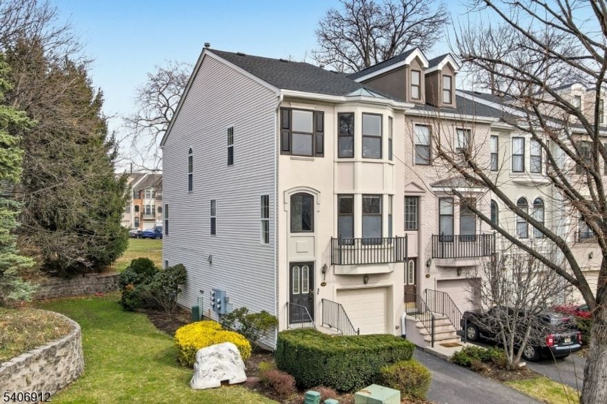 This stunning tri level end unit luxury townhome, located on a cul de sac w a great yard, offers an exceptional blend of modern design and thoughtful renovations throughout. The main living level was completely reimagined by removing all walls to create a true open concept layout, seamlessly connecting the expansive dining area, chef's kitchen, and light filled living room w a gas fireplace and an updated powder room. The kitchen is a true showpiece, featuring white cabinetry and backsplash, quartz countertops, a massive center island with a breakfast peninsula, farmhouse sink, & stainless steel appliances. Upstairs, the massive primary suite features cathedral ceilings, a beautifully spa like bath that was renovated just weeks ago. The brand new vanity with dual sinks, expansive shower with custom glass doors, mirrors, and lighting complete the space. The second bedroom is generously sized w two closets and access to the 2nd updated full bath. The laundry area is conveniently located on this level. The lower level offers a large & flexible space that can function as a bedroom, office, or both, along with a 3rd full bath, garage access, and a walk out to a private patio with an incredible yard that is perfect for grilling and outdoor entertaining. Additional highlights include wood flooring throughout - no carpet, freshly painted, 2 gas fireplaces, a driveway that accommodates two vehicles. A rare opportunity for a beautifully updated end unit townhome. This home won't last!