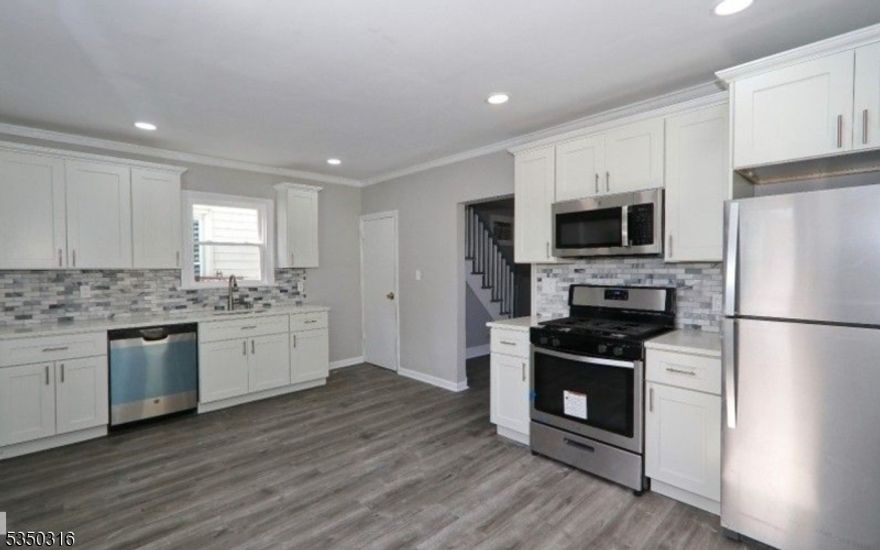 Just what you've been waiting for! An updated spot in a central and convenient location. Single family home. Renovated 2020 . Large Eat in Kitchen, New Cabinets, Quartz Countertops, Stainless Steel Appliances. 2 Newly Tiled Bright Full Baths. Separate office area off the large 3rd Bedroom. GE W/D. Freshly Painted, New Flooring throughout. Kitchen opens up to Large Deck overlooking large beautiful fenced in landscaped yard. Abundant Resident Only Free Permit Parking on all surrounding streets. Built in AC Unit.  Near great restaurants, shops, and Garwood train station. Private parking space available for separate rental.