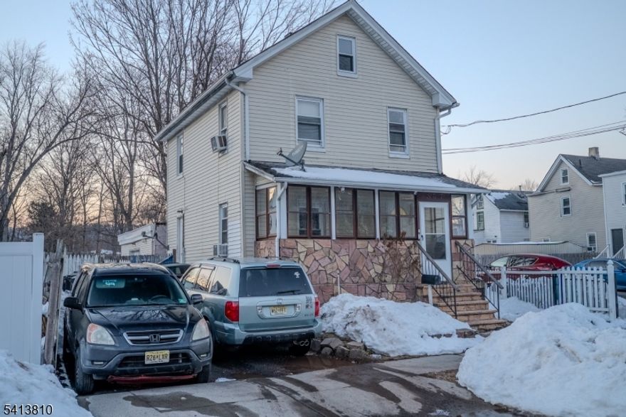 This substantial 4-bedroom, 1.5-bath Colonial offers incredible "bones" and massive potential. The footprint includes a traditional layout with standar size  rooms and a full basement. Located on a quiet stretch of East 2nd St, this home is being sold strictly As-Is