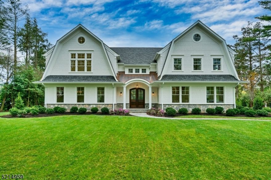 28 Linden Lane is a unique combination of grace & sophistication, with an updated contemporary flair. Elegantly sited and situated on Chatham's premier street, with extensive attention to detail and incredible high-end features this newly-crafted home is the epitome of luxury living. Created and constructed by Triano Building Company, this 7 bedroom, 7 and 1 half bathroom home boasts over 8300 square feet of gracious living space. Special features of this unique home include; wide bluestone front walkway, solid double mahogany 10' doors, vast foyer, a sun-drenched great room, breakfast nook, gourmet kitchen, and thoughtfully designed custom pantry, The property is further enhanced by a sensational outdoor entertaining area of bluestone, gas fire table, outdoor TV, and built-in grill and refrigerator. This dream home is set on nearly  3/4 acres with expansive views of the professionally-landscaped grounds and mature trees.  All of this plus tranquility and privacy on perhaps the most beautiful street of custom homes in Chatham. Featuring a gym,194 bottle temperature-controlled wine closet, custom 18' bar serviced by an ice machine, beverage refrigerator & floating shelves for spirits; opportunities for entertaining and recreation abound!  An extraordinary primary suite with cathedral ceilings, gas fireplace, expansive walk-in closets, and spa bath. Generously sized, ensuite bedrooms, and laundry room outfitted for 4 laundry units. Finished 3rd floor perfect for additional