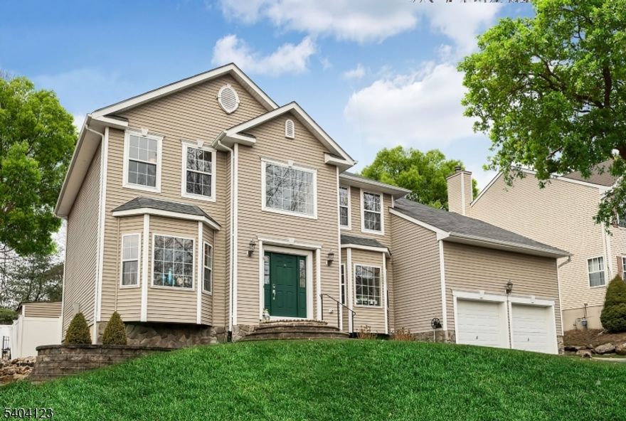 Welcome to this TURNKEY SHOWPLACE where all your home ownership dreams come true. This stunning Colonial features over $200K in NEW UPGRADED RENOVATIONS and all the bells and whistles you desire are here. Luxury, comfort and privacy all come together so you can just move in and enjoy your new home and gorgeous surroundings. Step inside a fabulous floorplan for living and entertaining with high ceilings, 1st floor office, oversized laundry room, convenient garage entry and a two story family room with dramatic stone fireplace. NEW DESIGNER KITCHEN shows off everyhing you love and is enhanced by new stainless appliances, gas cooking, drawer style microwave, under cabinet lighting & expansive double door pantry. PRISTINE HARDWOOD & EXOTIC TILE FLOORING run thoughout entire 1st & 2nd floors (no carpet at all!). THREE NEW DESIGNER BATHROOMS have been created with high end materials and present spa like environments. Finished basement is a fabulous GUEST SUITE with a second kitchen, full bath, multiple living spaces and storage. RESORT STYLE LIVING is right here in your backyard outdoor oasis with leveled fenced in yard, paver patio and a salt water pool with new cover, filter, heater & liner. PUBLIC UTILITIES, whole house generator, sprinkler system and backyard shed are all extra enhancements. PRIME LOCATION, wooded lot and quiet cul de sac street with easy access to all major roads, schools, shopping, lake activities, lakeside dining and an easy NYC commute by car or train.