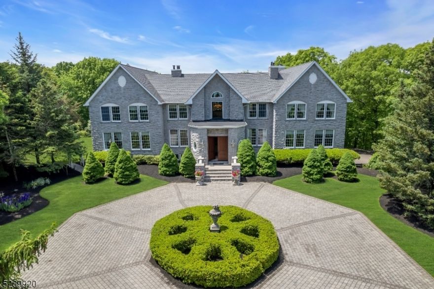 Experience the ultimate luxury in this stunning custom home, inspired by the grandeur of a chateau. nestled on a private mountain, this exquisite property spans 10.36 acres and is accessed via a private road leading to a circular driveway and a 3-car garage. Enter through the grand 2-story foyer, and be greeted by a magnificent stained glass Fresca, setting the tone for the elegance that flows throughout the home. The grand 2-story living room features a stunning woodwork fireplace and is bathed in natural light. The gourmet kitchen is equipped with custom wood cabinetry, WOLF appliances, a breakfast bar, making it a chef's dream. The master bedroom is a luxurious retreat, spread across three levels, with a cozy fireplace, walk-in closets, and a grand en suite with a soaking tub overlooking the serene backyard. A convenient first-level guest ensuite ensures comfort for your guests. The 2nd floor offers 3 bedrooms, 3 baths, an office, and a study room. The basement is an entertainer's paradise: 9-seat movie theater, game room, gym, sauna and bathroom. The backyard is a serene and private masterpiece with blue stone terraces, a unique salt-water pool with a spa, an outdoor kitchen, and a fireplace, perfect for outdoor relaxation and entertainment. Enjoy the tranquility of this private mountain estate while being less than an hour from New York City. This property is a serene retreat that offers unparalleled luxury and privacy.