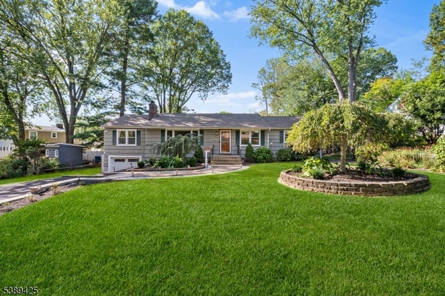 Step into this warm and inviting ranch-style home, offering 4 spacious bedrooms and 2 full baths, perfectly designed for comfortable one-floor living! The inviting foyer leads to a bright formal living room with a stone accent wall and wood-burning fireplace. The formal dining room and updated eat-in kitchen with stainless steel appliances, granite countertops, and ample storage make entertaining effortless. A large family room provides flexible living options, ideal for a home office, playroom, or guest suite   with a full bath (partially renovated) conveniently attached. Down the hall, you'll find four generously sized bedrooms with ample closet space, a newly renovated hall bath, and gleaming hardwood floors throughout. The spacious basement offers high ceilings, great storage, cedar closets, and potential for easy finishing to add even more living space. Step outside to your own natural sanctuary with an expansive Trex deck, lush landscaping, and open green space ideal for entertaining, play, or a future pool. Additional features include a one-car attached garage, a newer roof, and central air, and numerous 2024"2025 updates. Located just blocks from Blue Ribbon Deerfield School, minutes to NYC bus and Summit train station, and close to cafes, restaurants, shops, and major retailers. This home offers suburban charm with city convenience! ***Mortgage savings may be available for buyers of this listing. 24 hours' advance notice required!