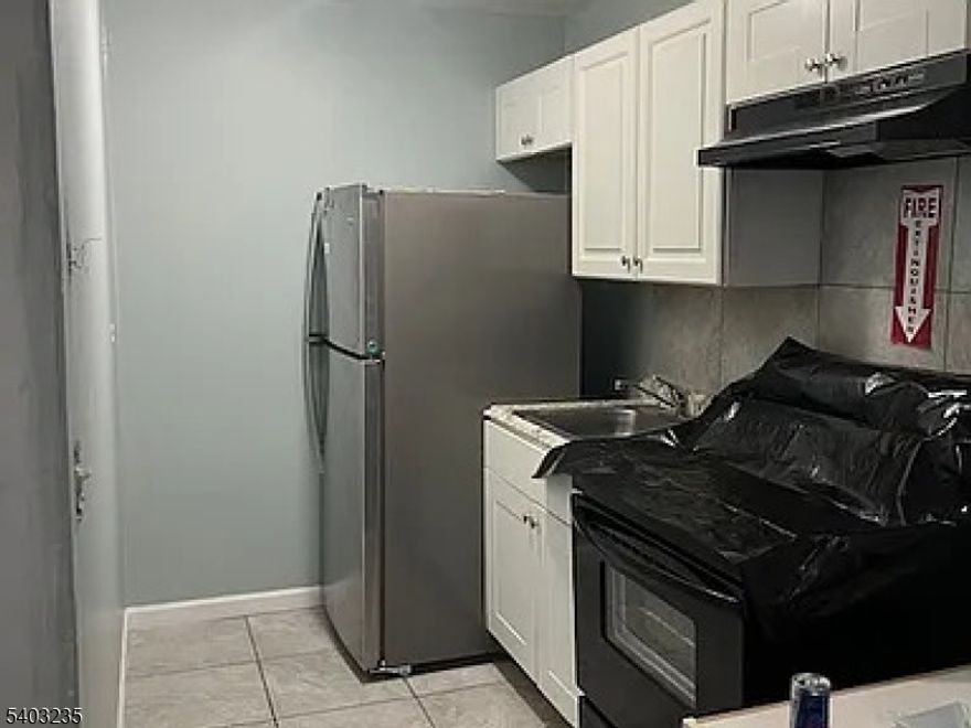 1266 Washington Ave, Unit 15, located on the 2nd floor in the West Side section of Asbury Park, is a 1-bedroom, 1-bath apartment offering a functional layout with a comfortable living area, a kitchen with ample cabinetry, and a bright bedroom. The bathroom features tile finishes and standard fixtures. The property is close to NJ Transit bus routes, downtown Asbury Park dining and entertainment, local parks, and the Asbury Park train station, with convenient access to the boardwalk and major roadways.