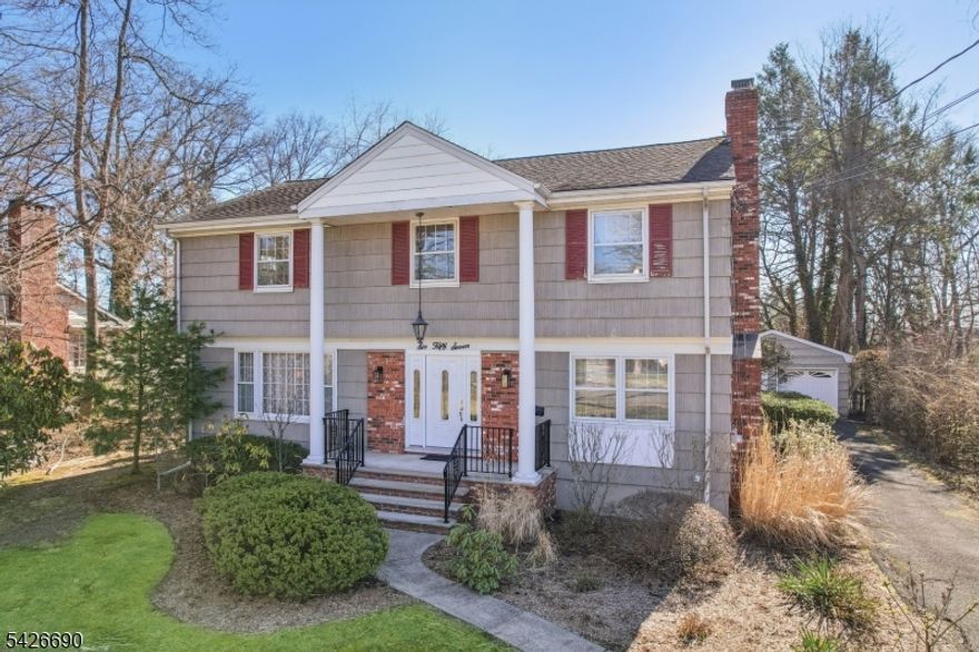 Nestled on a generous, nearly half-acre lot in a desirable Glen Rock location, this classic 4-bedroom, 2.5-bath Center Hall Colonial offers exceptional space, character, and potential! Featuring a traditional layout, the home welcomes you with a stately exterior that transitions into an inviting entry foyer, leading to spacious living areas filled with natural light. Enjoy seamless flow between the living room, formal dining room, and bright eat-in kitchen with ample cabinetry. A charming family room with a floor-to-ceiling brick fireplace and a powder room complete the main level. Upstairs, you'll find four well-proportioned bedrooms, including a primary suite with its own bath. A finished basement provides valuable additional living space, ideal for a recreation room, home office, or flexible use. The property also includes a detached 2-car garage, an expansive deck for entertaining, and a large, level yard offering plenty of room for outdoor enjoyment, gardening, or designing your own outdoor oasis. Conveniently located near schools, parks, and NYC-bound trains and buses, this is a wonderful opportunity to make this charming home your own in one of Bergen County's most sought-after communities.