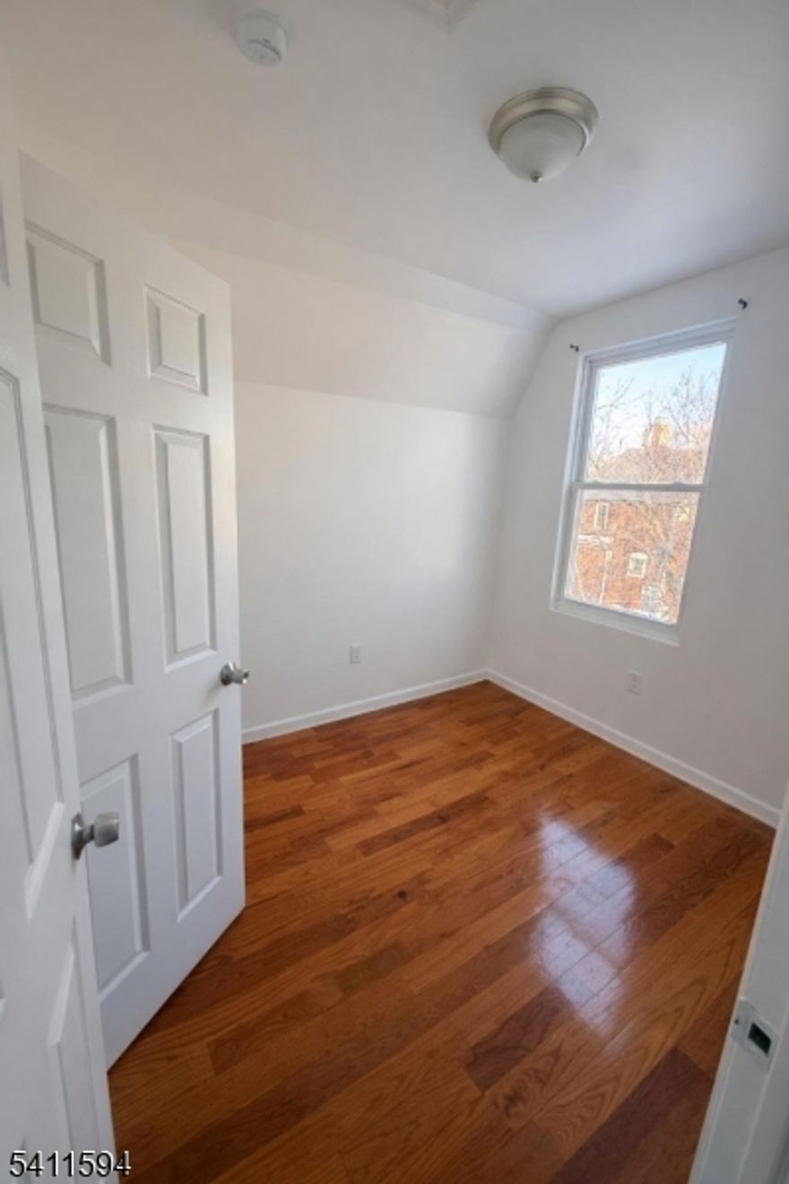 Welcome to this bright and comfortable 2-bedroom, 1-bathroom apartment located on the third floor of a well-maintained multi-family home in Newark. Step into a freshly updated unit featuring a spacious living/dining area, modern kitchen, and ample natural light throughout. Each bedroom offers generous closet space and room for relaxation or work-from-home comfort. Updated kitchen with plenty of cabinets and countertop space. Bright living room with large windows, Hardwood flooring throughout. Street parking available. Convenient location near schools, parks, and public transportationLocated minutes from major highways (Garden State Parkway, I-78) and downtown Newark, this apartment offers both comfort and convenience for commuters.