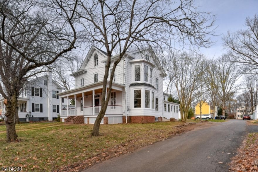 This beautifully renovated 4-bedroom, 3-full-bath circa 1856 Colonial in historic Millstone offers a seamless blend of original character w/modern upgrades & complete interior & exterior renovations in 2025. The inviting front porch is finished w/teak flooring & southern yellow pine ceiling provides exceptional curb appeal and a perfect place to relax. The spectacular 24x20 kitchen serves as the heart of the home, featuring new windows, custom cabinetry, quartz countertops, stainless steel appliances, a vented microwave, recessed lighting & a remote-controlled gas fireplace. Additional 1st floor highlights include a full bath, hardwood oak flooring, living room with an oversized bay window, den w/custom built-in bookcases, a laundry room w/new 2025 washer/dryer & an enclosed side porch. Most original windows remain & have been meticulously reglazed.  The 2nd floor offers new neutral carpeting throughout, 2 generous full baths & a spacious primary suite w/a walk-in closet.The exterior showcases a combination of aluminum siding & original cedar clapboard, complemented by a large 32'x15' paver patio and a new shed. Major improvements include a 30-year roof, 200-amp electrical service, both the 50 gal hot water heater and dual HVAC units are high efficiency direct vent. There is a 4 BR Norweco septic system. The full DRY basement provides storage, utility space and includes a new sump pump and fresh Loctite paint.  Move-in ready and meticulously upgraded throughout,