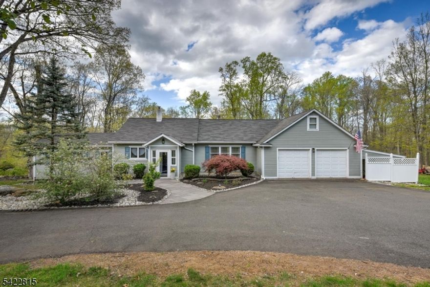 Set on 1.9 acres of peaceful, private land, this beautifully maintained 2-bedroom, 2 1/2 bath ranch with a dedicated office that can easily be used as a third bedroom, offers a perfect blend of comfort and tranquility. The spacious eat-in kitchen with abundant cabinetry, and generous counter space, ideal for everyday living and entertaining. It flows seamlessly into a large living room highlighted by a cozy wood-burning stove perfect for creating a warm, inviting atmosphere during the colder months. Sliding doors from the kitchen lead to a rear deck overlooking the scenic backyard, wooded surroundings, and a stunning paver patio complete with a pergola and outdoor fireplace/barbecue an ideal setting for relaxing or hosting guests. The preserved Delaware & Raritan Greenway borders the property on the west side, enhancing the home's sense of privacy and natural beauty. Located in the highly desirable Hunterdon Central Regional High School district, this home also offers convenient access to major highways, as well as nearby destinations including Princeton, Flemington, and the charming river towns of Lambertville and New Hope. Additional features include a workshop area and additional storage area on side of garage.