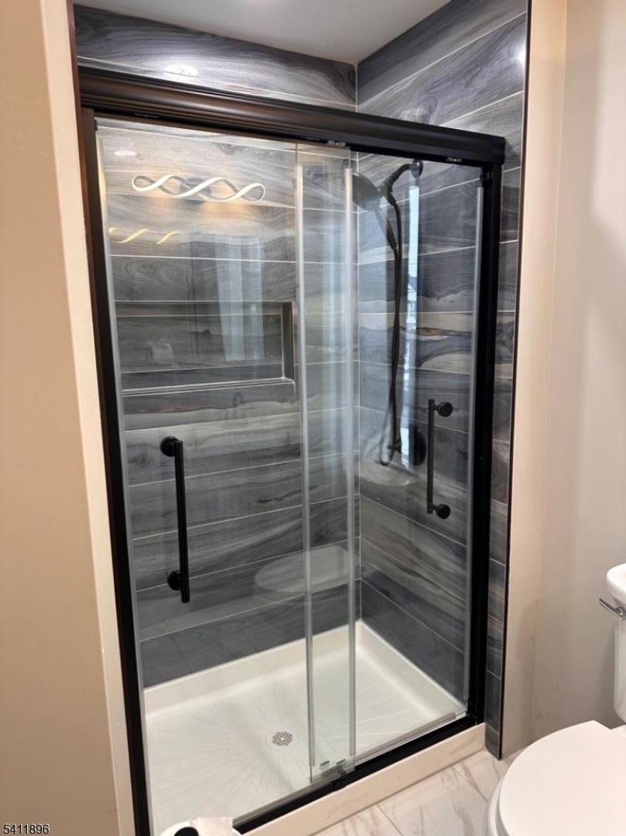 Spacious, bright, and move-in ready two-bedroom apartment on the second floor with a private entrance and separate gas and electric meters. This well-maintained unit features an updated kitchen with granite countertops, a full new modern bathroom, and new floors throughout. In-unit laundry comes with a new washer and dryer, new water heater and there is a versatile bonus room on the third level. Located just a short distance from the Raritan Train Station with easy access to New York, it's excellent for commuters. The home offers convenient access to Routes 22, 202, 206, I-287, and I-78, and is minutes from Downtown Somerville. Near to LabCorp, Johnson & Johnson, Dukes Island Park, as well as downtown Raritan with shops and restaurants, are nearby for easy recreation and errands.