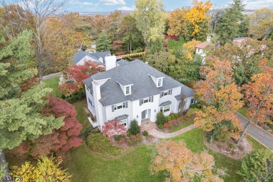 MOVE-IN READY STUNNER! State-of-the-art 5 Bedroom, 4.1 Bath offers every bell and whistle, with exclusive updates and renovations; minutes from fabulous downtown shopping, restaurants and NYC transportation. Nestled on pristinely landscaped property, this Center Hall Colonial showcases soaring high ceilings, impressive 2-story spaces, and an open floor plan that shines with incredible attention to detail and expert craftsmanship. Breathtaking Entry with dazzling hardwood floors and a unique "1 and 1/2  staircase leading to both the expansive back rooms as well as upstairs. BRAND NEW Gourmet Chef's Kitchen with an oversized island, additional wet bar, marble, quartzite, Thermador appliances, generous walk-in Pantry w/ skylight, open to the bright and gorgeous sunken Family Room, a 2-story space with vaulted ceilings and custom fireplace. Primary Bedroom with Entry Area, hardwood floors, walk-in closet, and a picturesque luxury Bathroom. 3 additional bedrooms including 1 with a spiral staircase to its own private loft. Sprawling ensuite Bedroom on the 3rd floor with massive closets and storage space. Lower Level is GIGANTIC, a dream for entertaining w/ endless possibilities, complete w/ inviting fireplace AND Full Bath and immense storage space. Sensational marble and tile featuring high-end perks including heated shower floor and toe-kick vanity heaters. Don't miss the opportunity to make this amazing wow-factor house yours before someone else does!