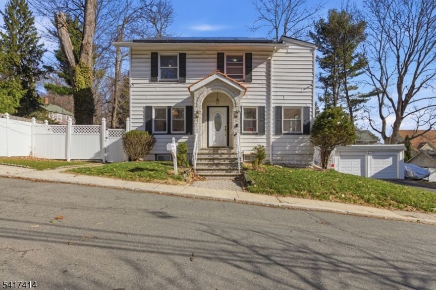 This is a rare opportunity to enjoy New York skyline views while living in the charm of a North Jersey suburb. Built in the 1920s, this home approaches its centennial ready for a thoughtful blend of historic character and modern updates. The purchase includes brand-new kitchen appliances and a clean slate to create an elegant tribute to the past with room for contemporary improvements. Highlights include wood floors, abundant natural light, a finished basement with kitchenette, a detached garage with leased solar, a private backyard, and off-street parking.