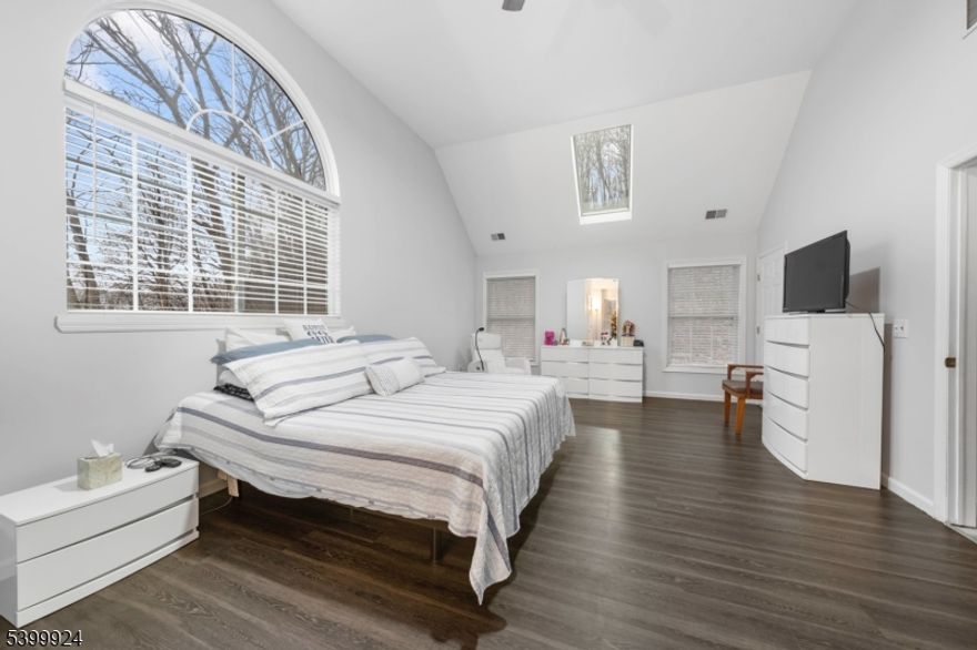 Beautifully updated Colonial nestled on 4 private acres in peaceful Knowlton, NJ. Enjoy a charming covered front porch, landscaped grounds, and serene natural surroundings. This home offers 4 bedrooms, 2.5 baths, a large 2-car garage, and spacious indoor/outdoor living areas. The open kitchen features granite countertops, stainless steel appliances, and a generous dining area. The inviting family room highlights a stone fireplace and oversized picture window with gorgeous views. A first-floor office with French doors is perfect for working from home. Formal dining/living rooms open to an expansive rear patio ideal for entertaining. New LVP flooring throughout the first level. Upstairs, the primary suite includes two cedar walk-in closets, a skylight ceiling, and a private bath. Three additional bedrooms and a full bath complete the second floor. The basement provides excellent storage, flexible space, and a small wine cellar/craft room. Recent updates include a **brand-new stove, microwave, and garage door openers. A rare combination of beauty, privacy, and comfort move-in ready and truly special.