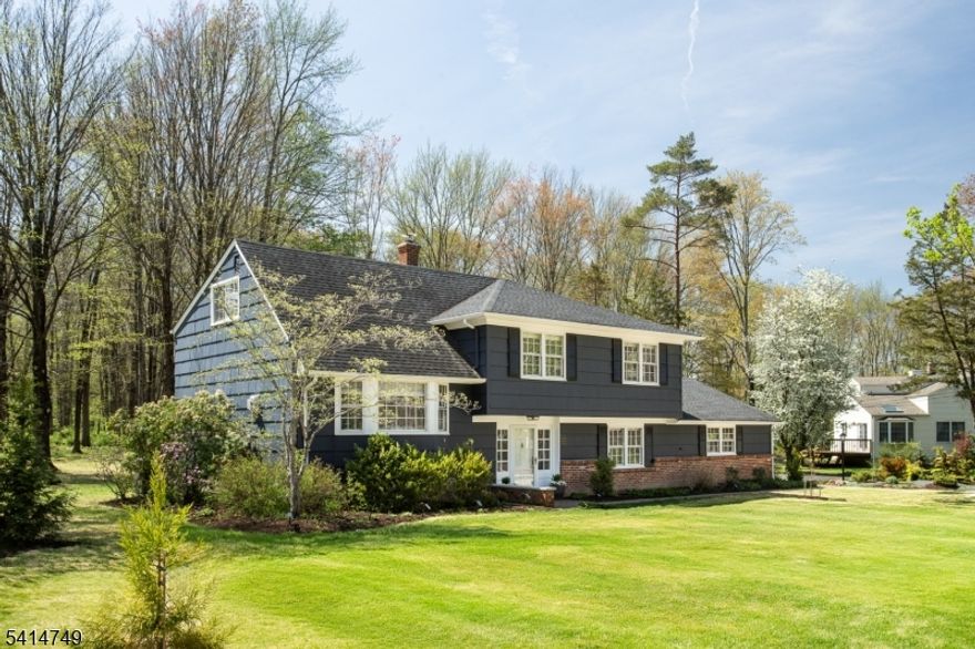 Beautifully renovated 4-bdrm, 2.1-bath home set on .73 acres of flat, landscaped property in a highly convenient location with top-rated schools. Just a short walk to the Lyons Train Station, Lyons Mall, and nearby bus transportation, this home offers the perfect blend of suburban comfort and commuter convenience. Thoughtfully updated throughout, the home combines classic character with modern upgrades and a bright, open layout ideal for everyday living and entertaining. Major improvements include a newer roof, furnace and central air conditioning, and a new hot water heater. Exterior upgrades include newer gutters and leaders, refinished driveway, exterior painting, and extensive landscaping with more than 100 perennial plantings, shrubs, and trees that create a beautiful outdoor setting. A new rear garage door provides convenient backyard access. Inside, refinished hardwood floors run throughout. The fully renovated kitchen features custom maple cabinetry, leathered granite countertops, a Thermador range with hood, Jenn-Air refrigerator, integrated dishwasher, microwave drawer, tile backsplash, and updated lighting and electrical. Additional highlights include Marvin windows and sliding doors, a Velux skylight with solar blind, updated bathrooms, porcelain tile flooring in the lower level, solid wood interior doors with Emtek hardware, custom Roman shades, a renovated laundry room, and a Regency Bellavista gas fireplace. Move-in ready and turn key!