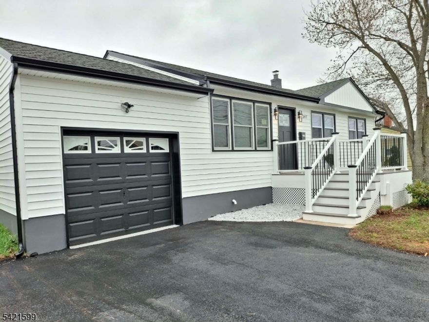 Amazing Ranch home thoughtfully renovated 2026 in the heart of Colonia, NJ. This 4 Bedrooms 2 Full Baths home offers a layout designed for both everyday living and entertaining, with a finished Basement and bonus space well suited as a 4th Bedroom, office, or playroom. A welcoming front porch sets the tone, while inside you'll find bright, open living spaces with hardwood floors and abundant natural light. The Kitchen opens to a spacious Living Dining room with center island, creating an inviting gathering space that has door to the backyard for effortless indoor-outdoor entertaining. Positioned within close proximity to Colonia's highly regarded public schools, as well as the Metropark and convenient transportation to NYC via bus or train, the location supports both lifestyle and commute. Rear access from yard to the garage and backyard adds everyday convenience. With its elegance, updated interiors, and prime setting, this home captures the essence of Colonia living.