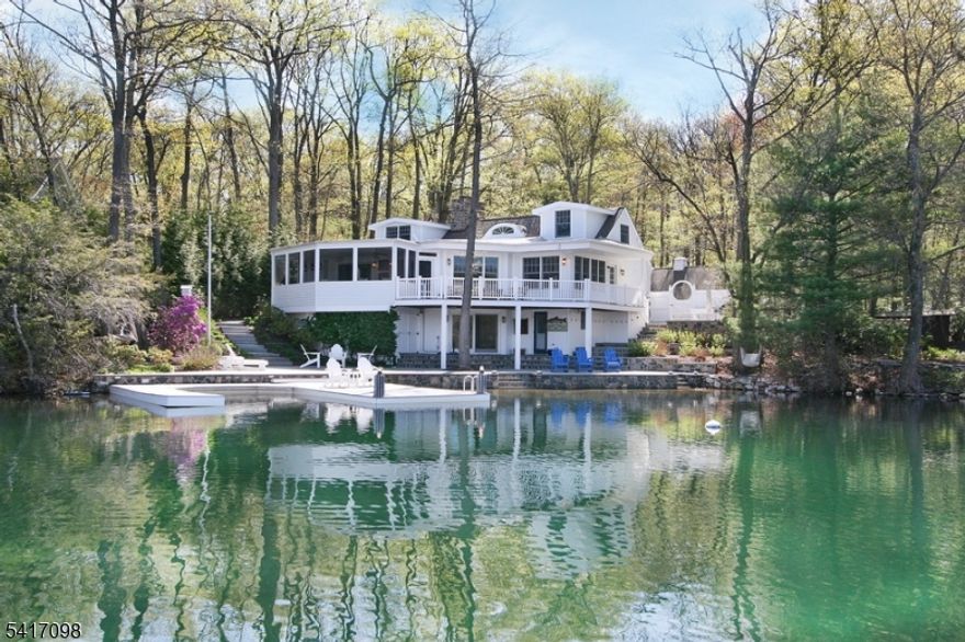 Discover the perfect blend of serenity and sophistication at 140 Lake End Road, nestled in the  private enclave of Lake End Corporation at beautiful Green Pond. This stunning lakefront home is one of just 66 properties where residents enjoy direct access to the pristine, spring-fed waters of Green Pond and breathtaking lake and mountain views.Renovated with exquisite taste and custom designer touches throughout, this lovely 5+ bedroom, 3-bath home features a comfortable open floor plan that effortlessly accommodates guests. Special highlights include two cozy fireplaces, a relaxing screened porch, a spacious patio, a bunk room and a full walk-out lower level that opens directly to the lake. Outside, you'll find a private year-round dock perfect for boating and swimming, plus a detached 4-car garage for ample storage and convenience.Whether you're seeking a year-round residence or a peaceful weekend retreat, this exceptional property offers an unparalleled lakefront lifestyle in one of New Jersey's most cherished private communities. Don't miss your opportunity to make 140 Lake End Road your own slice of paradise at Green Pond! Home being sold furnished. The beauty, tranquility and protected environment of Green Pond, New Jersey's cleanest lake, makes the location of this distinctive community ideal for year-round living or a convenient weekend retreat.  Nestled in the Morris County foothills and centered around a 2.5 mile long natural