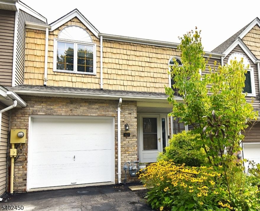 YES, It was Worth the wait! Life is Good in Desirable Skyview Heights w/ LOW HOA fees & the Luxury you deserve. Walk right in to the 1st floors stunning 2 story Foyer w/ Hardwood Floors throughout. Enjoy your scenic Living Rm (21 X 11) w/ Gas Fireplace, Skylights, Crown Molding & Sliders to your Large Deck. Host parties in Formal Dining Rm accommodating 12+ Guests. Make conversations easy & cooking a JOY with your Updated Kitchen boasting Open Views to LR, DR & Deck. Granite counter tops, Backsplash, SS Appl & Custom Coffee Bar.  Updated Half Bath, Garage with Work Bench & Basement entrance complete this floor. 2nd floor is a dream w/ a wide Hall for bookcases etc, while creating privacy between bedrooms.  You will love the MASSIVE Master Bedroom (21 x 13) w/ Full Bath, Walk in Closet & Mountain Views in distance.  HUGE 2nd Bedroom (17 X 11) also w/ Full Bath & Walk in Closet w/ Attic access/some flooring. Head downstairs to your Neat & Clean Basement with Recessed Lighting, perfect for an Exercise/Rec Rm.  Lastly, a Washer, Dryer, Slop Sink & Built in counter. This unfinished basement can easily be finished. End your tour by stepping onto your lovely deck & enjoying the quiet yard & serene views of the woods. Home also has a 2 car Driveway & street parking. Top it off w/ a Beautiful Clubhouse, Heated Saltwater Inground Pool, 2 Tennis/Pickleball Courts & Playground. Townhome in Parsippany with a Morris Plains mailing address. 1.5 miles from Train station. Owner is Lic Realtor