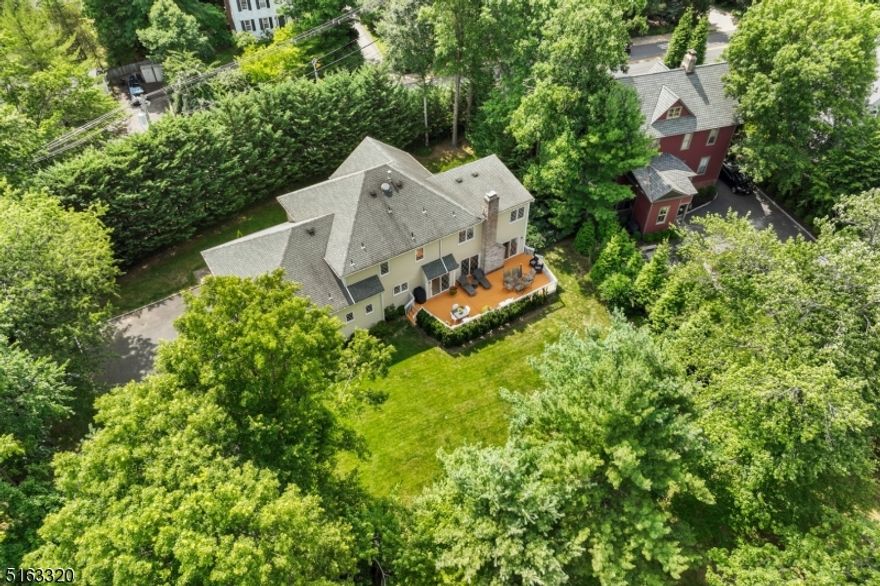 Location, Location, Location! Truly a hidden gem in the heart of Short Hills. Perched on .49 manicured lot, this home is a secluded oasis! 1st floor boasts a grand foyer, open floor plan w/hwd floors in the formal family room, equipped w/cathedral ceilings, skylights w/tons of light, opens to large family room w/wd burning fireplace & two sets of glass sliders to a 2-tiered deck for all your entertaining needs. Family room opens to a large eat-in-kitchen, center-island w/seating, stainless steel appliances, LG gas oven, newer LG refrigerator, newer Bosch dishwasher, a homeowner's dream of a deep pantry, laundry room w/sink & shelving, & glass sliders to 2nd deck for plenty of bbq's & playing. Kitchen opens to a spacious formal DR for the perfect flow. Convenient 1st floor in-law suite w/full bthrm, 2-car attached garage & a conveniently located powder rm rounds out the 1st floor. 2nd floor boasts 4 oversized bedrooms, tons of closet space, & spacious shared bath w/two sinks.  A grand primary bedroom w/2 walk-in closets, en-suite bathroom w/two sinks, stall shower, jetted tub & private water closet. Partially finished basement w/high ceilings, plumbed for full bathroom, tons of space for a rec. room, gym, wine room, anything you desire! Backyard is perfectly private w/a 2-tiered deck, fully fenced-in yard. See Improvement List for tons of updates! Steps to NYC train, Papermill Playhouse, SM Reservation, Millburn Downtown, Shops, Restaurants, Top Rated Schools!