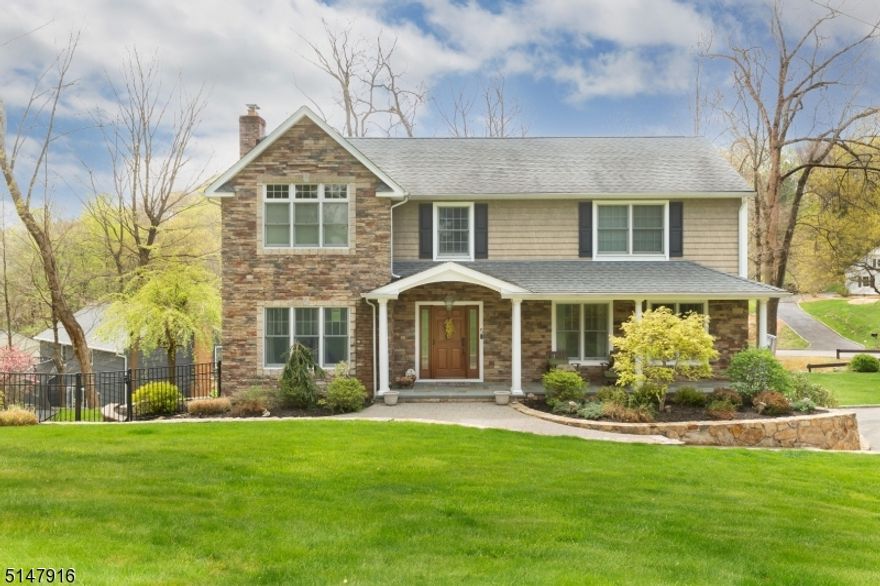 Stunning, custom built colonial with all of the modern features one could wish for!  This four bedroom, 3 1/2 bath home has hardwood flooring, high ceilings, huge finished basement with game room, fabulous office to work from home and upgrades galore!  Enjoy amazing views and entertainment options galore from the custom built patio with custom stone walls and outdoor kitchen with granite!  Bright, open kitchen featuring custom cabinetry throughout, granite countertops with double stainless steel sink and pull porcelain tile backsplash with decorative Mosaic tile.  Formal Dining Room with hardwood floors, recessed ceiling lights with tons of natural sunlight!  Living Room with a wood-burning fireplace with custom wood mantel and raised flagstone hearth.  Bedrooms feature all hardwood flooring. Porcelain flooring in master bathroom and a picture perfect tub/shower in main bath.  The three car garage Which is really a four car garage minus the door, is one of the many WOW'S this property has to offer!  This home truly encapsulates elegant living and beauty!  The addition which has walls of windows into the lower level is one of my favorite parts. Putting the addition on this home made it a master piece. Quality craftsman!!!!