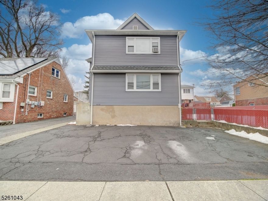 This charming 2-bedroom, 1-full-bathroom rental boasts an updated eat-in kitchen, spacious bedrooms, and a large family room. There is a driveway parking spot, supplemented by street parking. Washing machine in unit, dryer in basement. Tons of storage and workplace opportunities in basement. Conveniently located steps away from Ridge Road, this property offers easy access to public transport (approximately 2 blocks from the bus station and train station). ShopRite is approximately 2 blocks away. Situated approximately 15 minutes outside vibrant NYC (approximately 9.5 miles), this home combines suburban tranquility with close proximity to city life. Tenant is responsible for all utilities including water, electric, gas, cable, internet, and TV. Available Now!