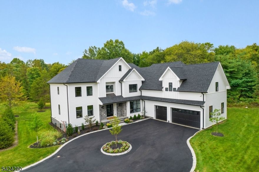 Welcome to Enclave at Brookside- a new gated subdivision nestled in a peaceful, country-like setting. Accessed by a private bridge and grand gates, this stunning property spans over 3 acres of lush land, offering the perfect balance of privacy and tranquility. This exceptional home features 7 spacious bedrooms and 6 and a half luxurious bathrooms across 3 finished levels, totaling an impressive 7,282 square feet of living space. Each level is thoughtfully designed for comfort, relaxation and entertainment, providing ample room for gatherings or quiet retreats. With expansive living areas, a gourmet kitchen with Viking appliances, huge primary bedroom suite with 3 walk in closets and a spa like en suite with heated flooring, and high end lavish finishes throughout, this home is a true dream. A whole house generator is also included. Step outside to enjoy the peace and privacy of your own private oasis while still being close to all of Warren's modern conveniences and just 33 miles to NYC!