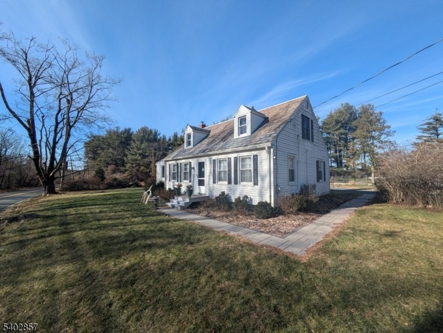 This is the move-in ready home you have been waiting for! Set on a serene one-acre lot that offers functionality and privacy, this beautiful cape home offers the rare combination of homestead appeal and NYC commuter convenience - just 5 minutes from downtown Princeton! As you enter the home, the convenient mud room leads you into a gleaming white kitchen with granite counters, stainless steel appliances, and tons of natural light. The kitchen opens into the spacious family room. A private sun room features a lovely fireplace. The lovely primary bedroom is located on the first floor. Each level has an updated bathroom! This home features major updates throughout, including a brand-new septic system rated for 4 bedrooms (2025) - allowing future owners to add on or expand, new floors (2025), high-efficiency mini-split HVAC (2023) with 4 independent zones (each bedroom plus living space), new electric hot water heater (2023), new wood stove (2023), and new shed (2023). Enjoy true nature, established garden space, and the freedom for chickens, goats, and fruit trees, all in a quiet, secluded setting that feels miles away yet remains minutes from Princeton Junction NJ Transit for an easy commute to New York City. Top-rated local schools complete this exceptional offering.