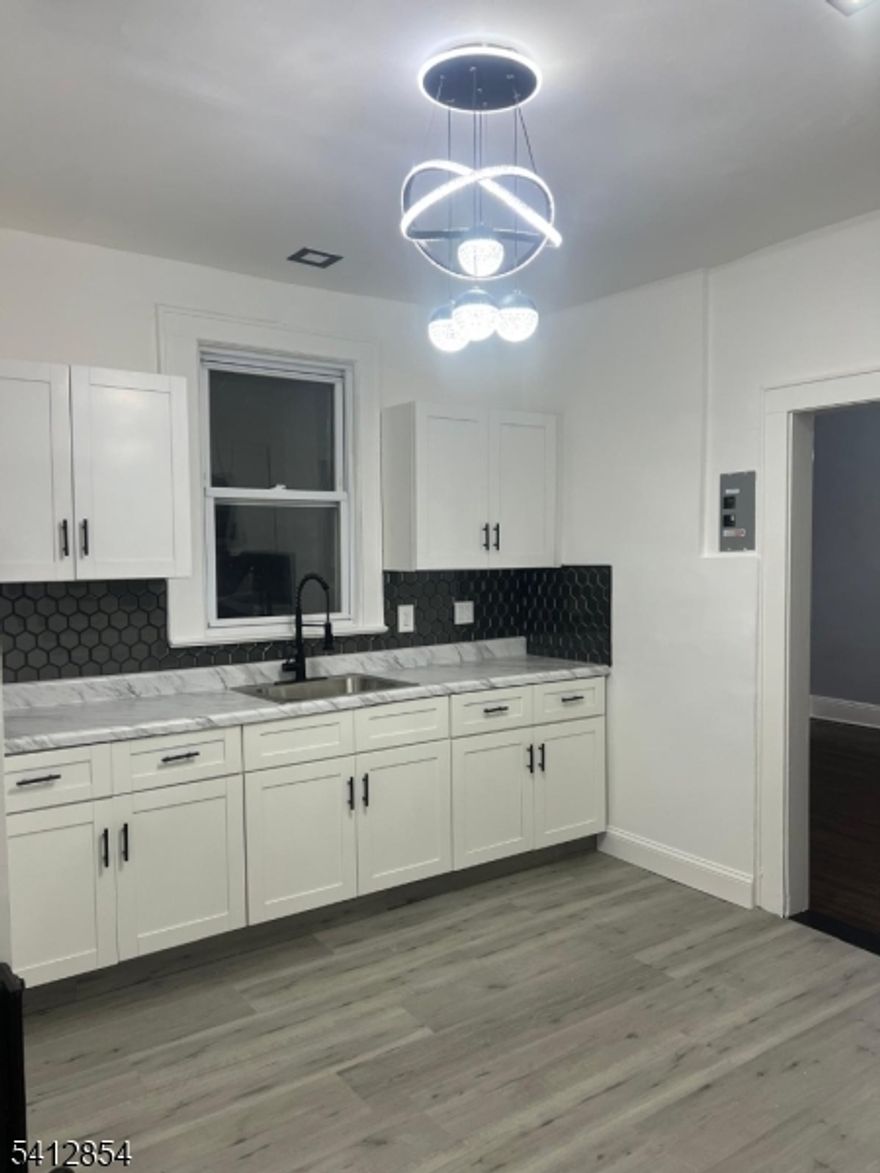 Welcome to this lovely first-floor 3-bedroom, 1-bath residence featuring one off-street parking space. Located just a short distance from Newark Liberty International Airport and major New Jersey Transit routes. Additional parking is available for an additional fee. Available 03/01