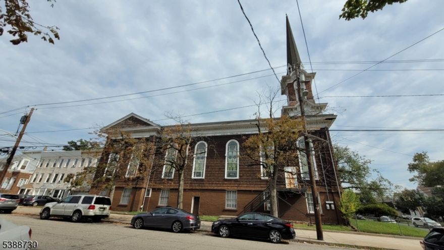 The property is located two blocks from the 34th Street Light Rail Station and a bus stop is present on the corner of 33rd Street and Avenue C. The upper level of the main building consists of a large space with pulpit/ alter and double balcony, narthex, office and bell tower access.The lower level consists of a meeting room, fellowship hall, full kitchen, restrooms and classroom. The adjacent house contains a kitchen, living room, dining room, office, enclosed porch and bath on the 1st floor and 5 rooms with a full bath on the 2nd floor. The property is listed on the National Register of Historic Places.