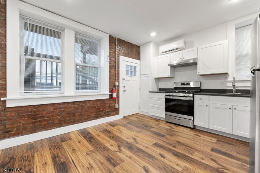 Garden Level 1 bedroom apartment just a few blocks from Walnut Street. Come enjoy a brand new kitchen & bathroom, multi-zone AIR CONDITIONING, lots of windows and exposed brick details. The kitchen is decked out with new appliances, exhaust hood, coat closet/pantry, and dining area. The bedroom has two large windows, a double wide closet and more exposed brick. Enjoy some late afternoon sunshine or the evening sunset on your back patio. You'll love being just 3 blocks from all that downtown Montclair has to offer, plus close proximity to Watchung Plaza. No laundry onsite. Multiple nearby neighborhood laundry options. PARKING is available for $100/month. No Pets.