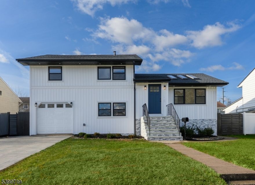 Welcome to this beautifully renovated home located in the highly desirable Fords section of Woodbridge. This spacious 4-bedroom, 2-bathroom property features soaring high ceilings, stunning skylights, and multiple flex rooms perfect for an office, playroom, gym, or guest space. The home also includes a built-in garage for added convenience. The renovated kitchen is a standout, featuring modern finishes and a 60-inch professional-grade stove, perfect for those who love to cook or entertain. Enjoy modern comfort with central air, plus mini-split systems on the ground floor and basement for optimal climate control. The backyard is an entertainer's dream complete with an in-ground pool and plenty of space for gatherings, relaxation, and outdoor fun. This move-in-ready home offers the perfect blend of style, versatility, and comfort. A must-see!