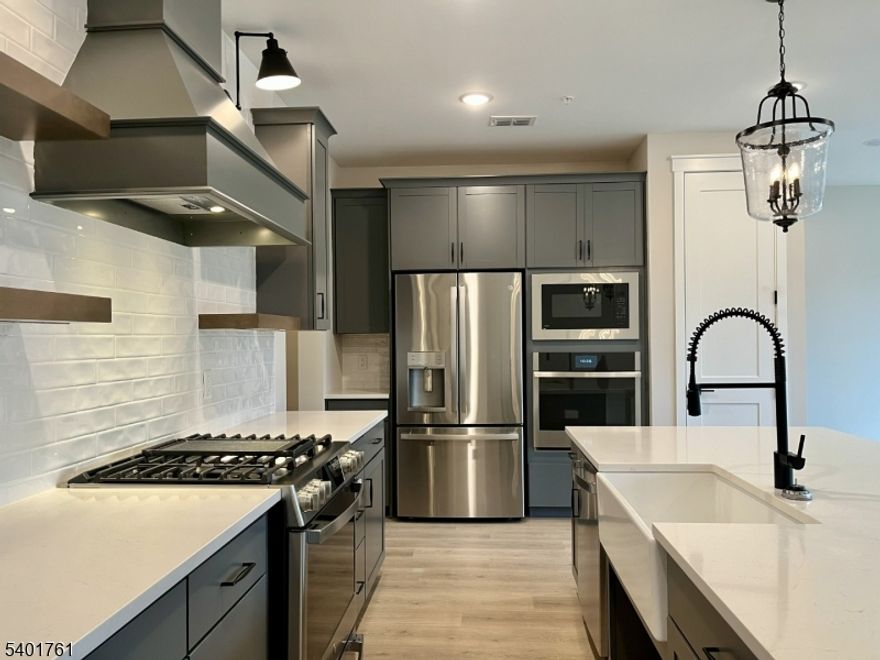 Welcome to a home where modern style meets ultimate convenience. Tucked away in a private and quiet corner of the community, this brand-new townhouse is designed for those seeking a peaceful retreat. Perfectly positioned for an easy commute, located just 12 minutes from Summit Train Station and minutes from local parks and shopping.The main level features an airy, open layout perfect for entertaining, anchored by a stunning farmhouse kitchen with granite countertops and brand-new stainless appliances. From the living room, sliding doors lead you out to a private deck overlooking the woods the perfect spot for morning coffee or evening relaxation in a serene, natural setting. Retreat upstairs to the second level, which houses a private primary suite, an additional bedroom, and a dedicated laundry space. With durable, upgraded wood-laminate flooring throughout, this home is as functional as it is beautiful. Don't miss your chance schedule a tour today and see what makes this home so special.