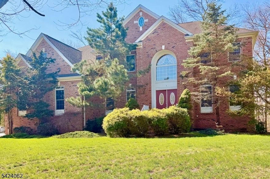 Amazing Castlebrook model in "The Legends Of Monroe''. Northeast Facing'' Estate on premium 3/4+ acre lot. Open floor plan, 9 foot first floor ceilings, custom dual split staircase to 2nd floor and the Juliette Bridge overlooks 2-story foyer & great room (equipped with gas fireplace). Double door entry, Center Hall colonial has wood floors and  1st floor-full bath by the oversized private office can be used for 5th bedroom(beautiful first floor suite). 4 full baths. Detailed crown molding package & designer paints throughout home. Designer, drapery enhance the Anderson Windows. Gourmet- Center Island kitchen equipped with: maple 42 inch cabinetry & crown molding, granite counters, tile backsplash, stainless steel appliances, fluted under mount stainless steel sink, kitchen exhaust vented outside, Chef's desk, pantry, custom lighting. The breakfast nook with sliders lead to 16'x33' Trex Deck with the most amazing yard & views. Formal living room & dining room. King's Suite with: sitting room, immense closet, bathroom with Jacuzzi tub- private shower, dual sinks, onyx counters. Fully finished (upgraded basement ceiling height, extra foot tall) Step out basement: kitchenette, full bath, theater (completely wired, the speakers are included), recreation room, den, other rooms. Sliders lead to paver patio, fire pit, private backyard. Bonuses: crystal chandeliers, recess lights, new driveway, 2zone heat, 2zone air, Laundry room, landscaped, irrigation, low taxes, and Steel I-beams.