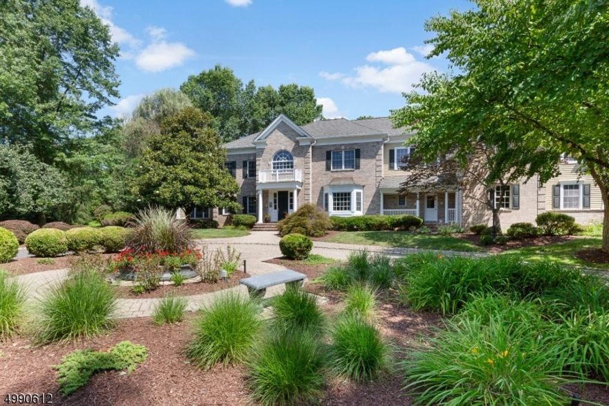 Understated Elegance with natural light,elaborate stacked crown moldings and exceptional architectural touches throughout. The unique floor plan is ideal for both grand entertaining or every day living. Pass through the private gated entrance onto the tree lined paver drive that graces the front  of this Stately home. Once inside the two story entry with custom inlaid  marble floor sets the tone for the formal rooms to either side of the foyer.High ceilings, pillared half walls, and floor to ceiling windows. A two story mahogany library with fireplace and spiral staircase. Open Kitchen to family Rm, Music room, and screen porch. The Master suite offers high ceilings, sitting Rm, dual fireplace master bath walk in closet & deck overlooking the grand yard with pool, spa, waterfall, gazebo and more.