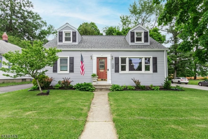 This charming 4-bedroom 2 full bath cape cod home sits on a quiet, tree lined street, in a highly desirable section of town. The updated kitchen is open to the light and bright living room with hardwood floors. The entertainment size deck, looks over park like property. The desirable in town location makes it perfect to stroll to the many restaurants, microbreweries, shops and more!