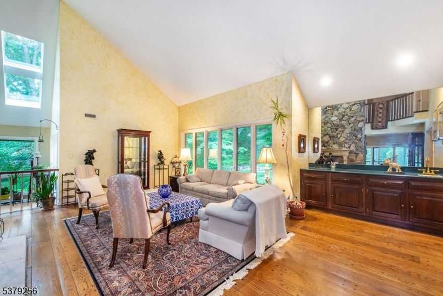 Welcome to 133 Rippling Brook Way! Drive into the Cul-de-Sac,down the private driveway and be impressed by this Spectacular 6 Bedroom home that sits on the most beautiful 3+ Acre lot. offering plenty of space and privacy. This combination of 5,000+ Sq ft,consisting of a 23X22 Master Bedroom Suite addition that has an attached office/sitting room (could be used as 6th bedroom) 2 Walk in closets.Gas fireplace,2 small sitting areas, and a Balcony overlooking the lucious gardens that are meticulously cared for, also features 3 Additional spacious second floor Bedrooms and Full bath, 2020 Renovated kitchen,Sunken Family room,Living room w/Vaulted ceiling,Sun Room boasting 4 Skylights,First floor bedroom ,Formal Dining room,Full bath,22X14 Deck  w/motorized awning,3 Car garage,Full unfininished walk out basement make this home the perfect blend of Luxury and Comfort .As well as a Full house generator,new hot water heater,AC,furnance,septic,reverse osmosis system,additional 4th garage/shed,