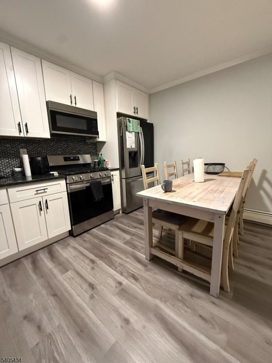 Recently renovated 2-bedroom, 1-bath apartment located on a quiet residential street in Linden. Features modern finishes and top-of-the-line appliances throughout. Laundry access on site for added convenience. Ideally located near shopping, dining, and public transportation. One designated parking space is included; garage parking is available for an additional fee. Apartment is offered unfurnished, furniture shown belongs to the tenant and is not included.