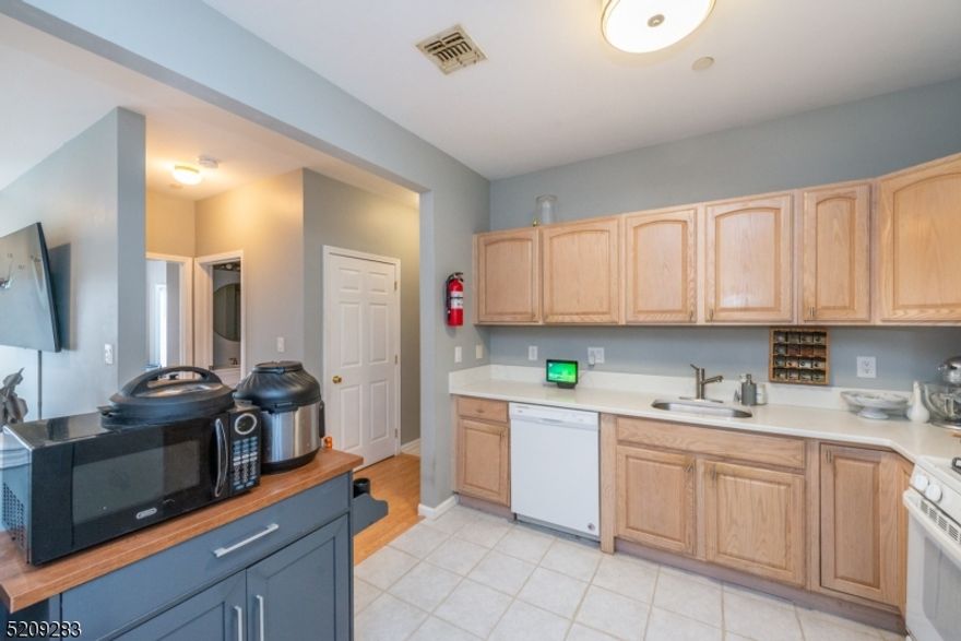 For recording purposes. Located at the gated community of Cambridge Heights - this condo is located on the main level offering 2 bedroom/2 bath condo, living room with fireplace [as is] and balcony, formal dining room, galley kitchen and utility room with both washer & dryer. Open, bright and a wonderful alternative to paying rent in today's market! Community center offers great space and outside inground pool..